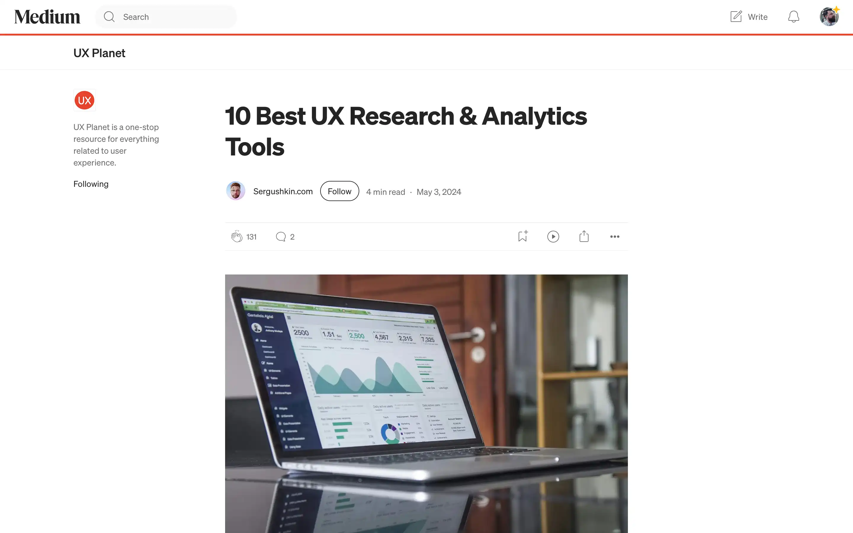 Laptop displaying UX research analytics dashboard