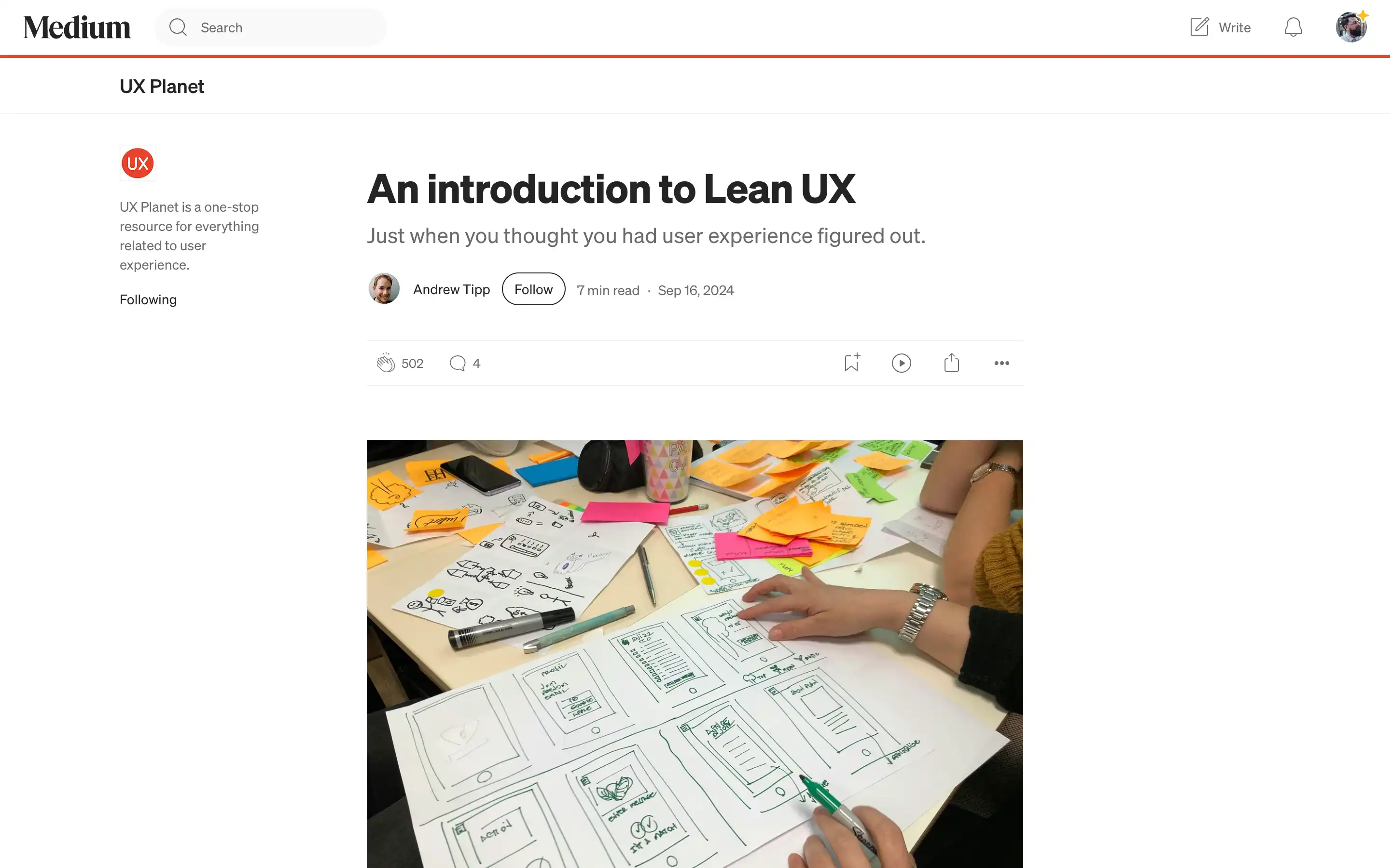 Team planning UX with sketches and sticky notes