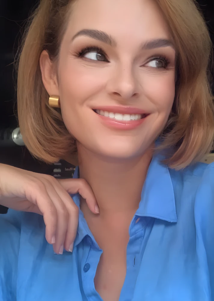 Smiling woman with bob haircut in blue shirt