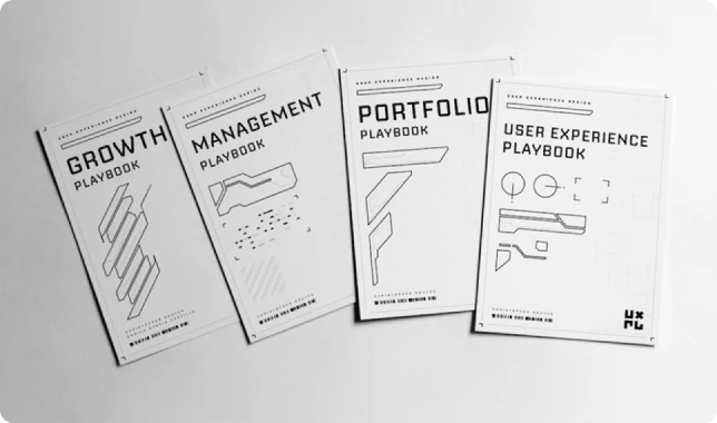 Four business strategy playbook covers on white background